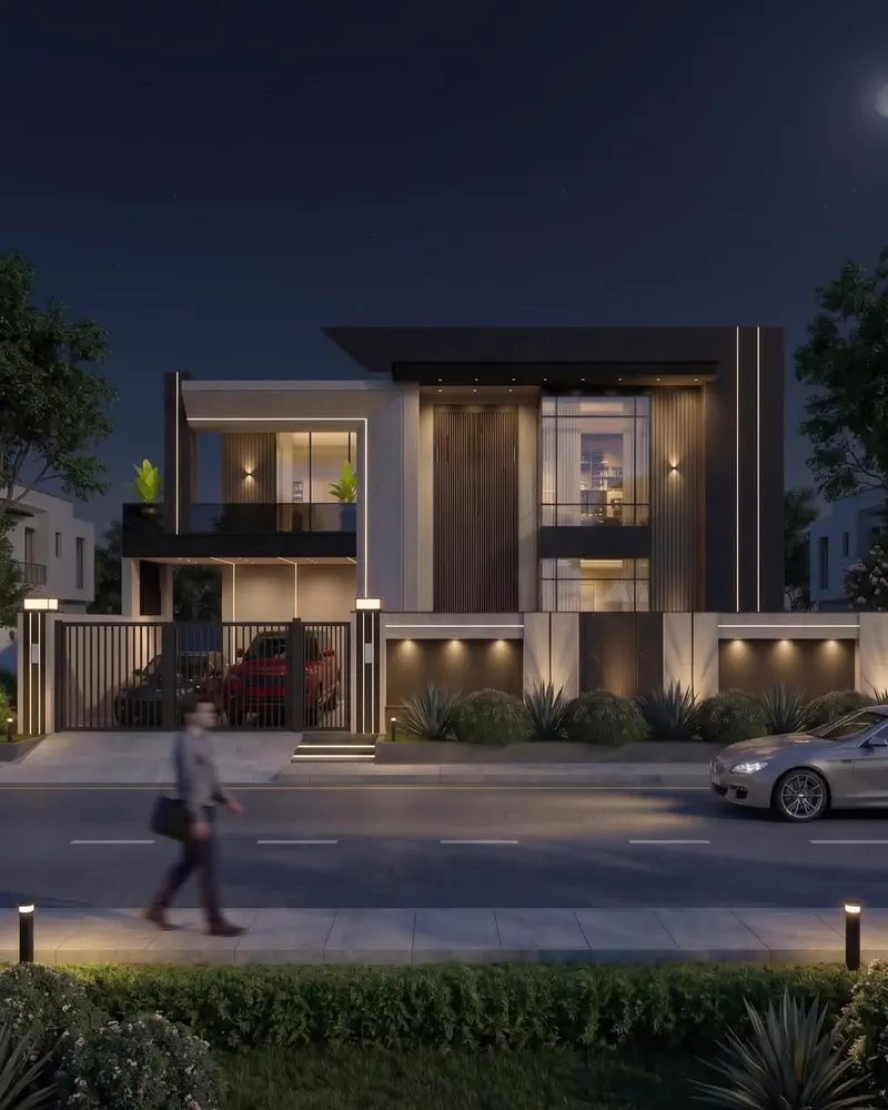 Modern villa street elevation at night with landscape lighting by Planet Builders