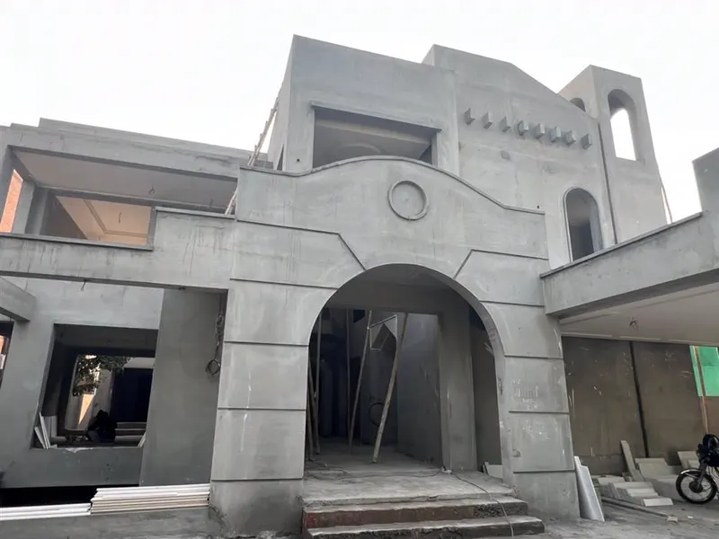 Grey structure construction in progress by Planet Builders