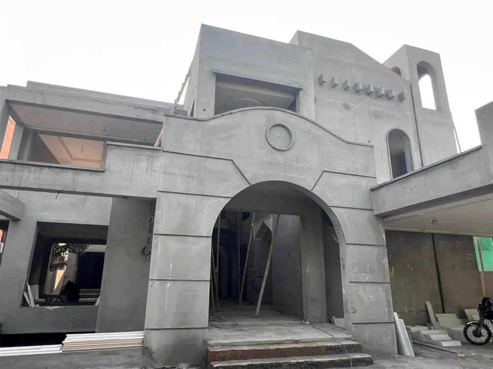 Cement and masonry work on a Planet Builders grey structure site in Lahore