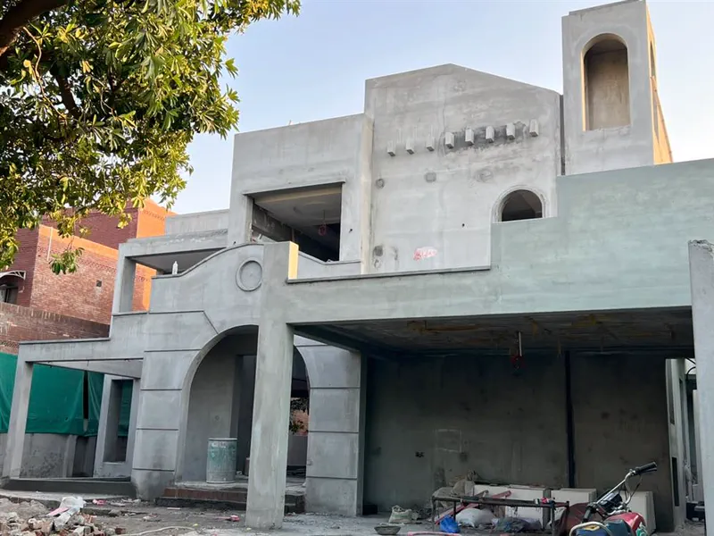 Grey structure construction with archway detail by Planet Builders
