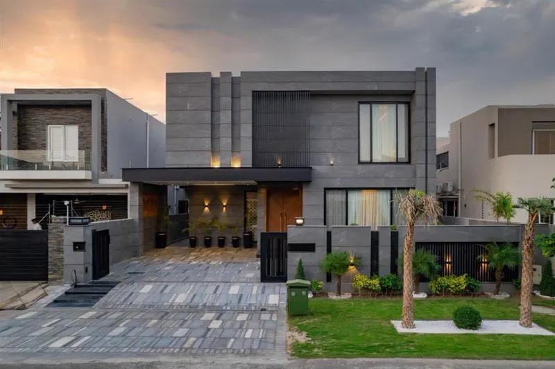 Completed modern stone-clad mansion by Planet Builders